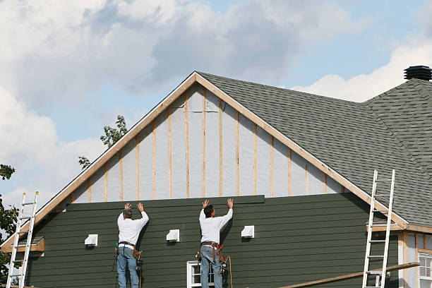 Professional Storm Damage Siding Repair technician working in Highland, NY